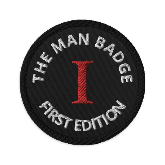 The Man Badge First Edition